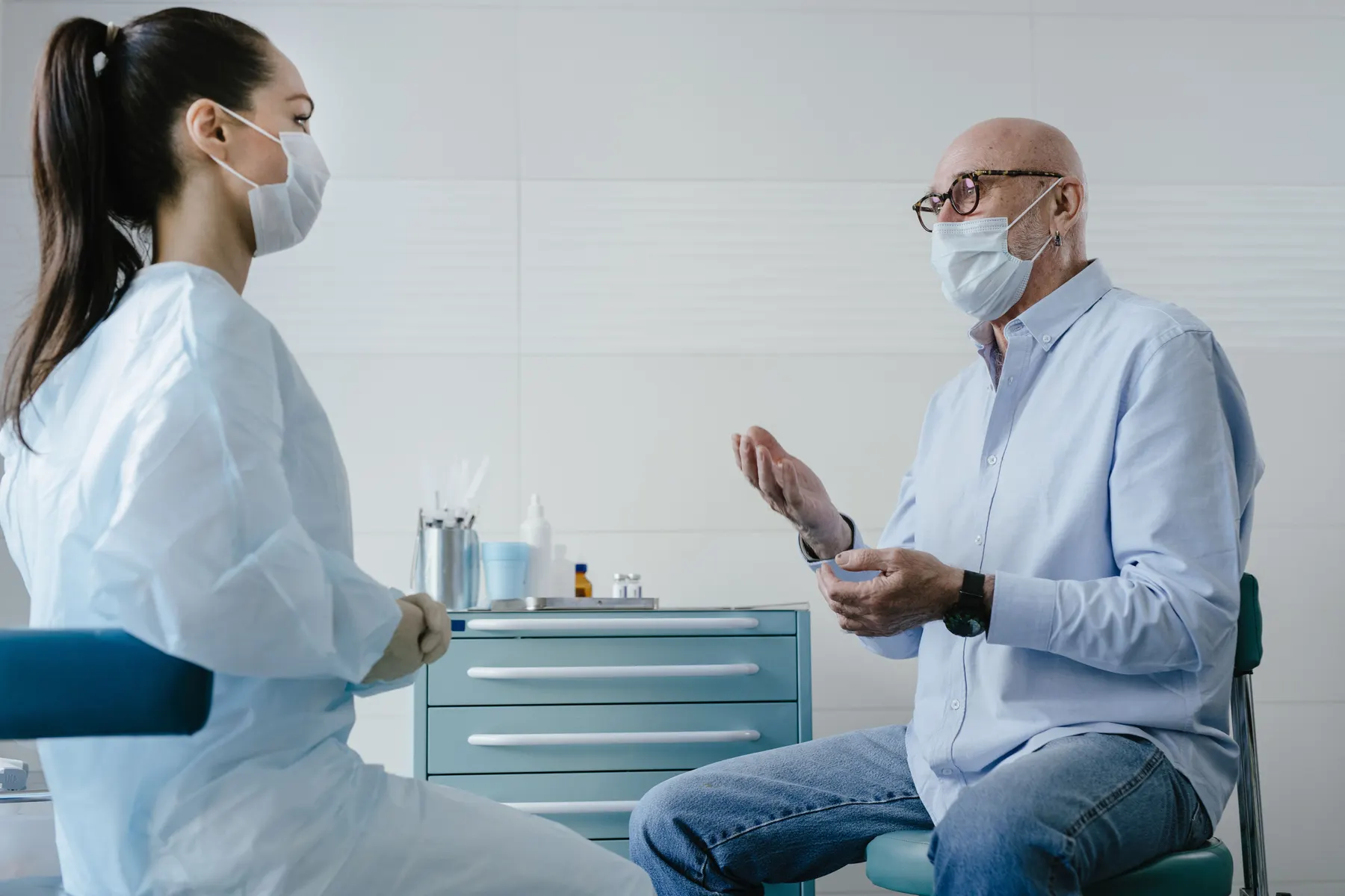An older adult speaking with a healthcare professional.